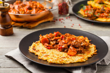 Hungarian potato pancake with goulash