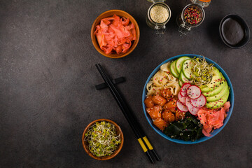 Hawaiian salmon poke bowl with seaweed, avocado, sesame seeds.