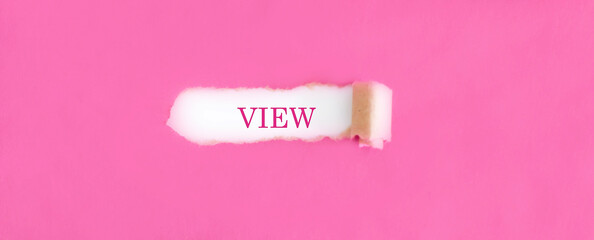 The text VIEW appearing behind torn pink paper.