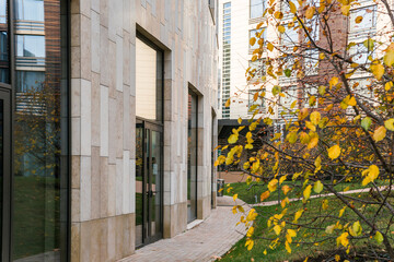Modern building with lawn and trees around