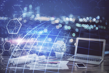 Multi exposure of table with computer and world map hologram. International data network concept.