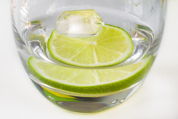 Cold lemonade. A refreshing summer drink. Water with lime, lemon or orange. Sour fruit. Nutrition...