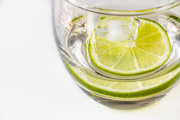 Cold lemonade. A refreshing summer drink. Water with lime, lemon or orange. Sour fruit. Nutrition...