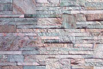 Background, texture laying of natural stone and blocks of different colors.