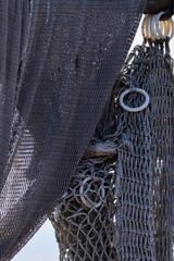 Fishing nets hang to dry in the sun, still lifes and objects. Fishermen, fishing net