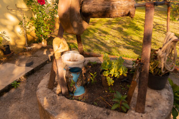 Disabled water well with blue teapot.