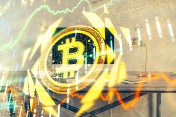 Double exposure of blockchain and crypto economy theme hologram and table with computer background....