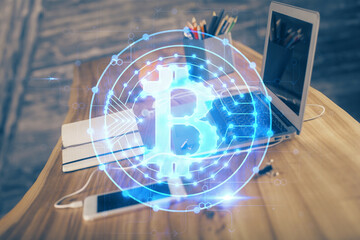 Double exposure of blockchain and crypto economy theme hologram and table with computer background....