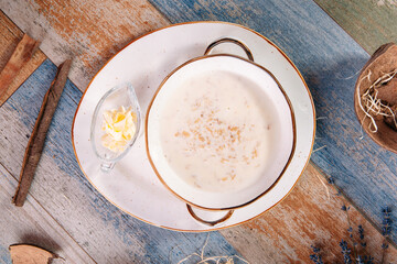 Healthy breakfast oatmeal porridge with butter