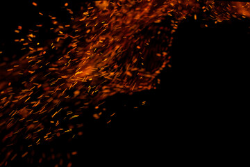 flame of fire with sparks on a black background