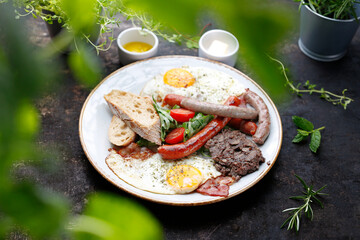 
Breakfast. Fried eggs, fried sausages, black pudding, salad.