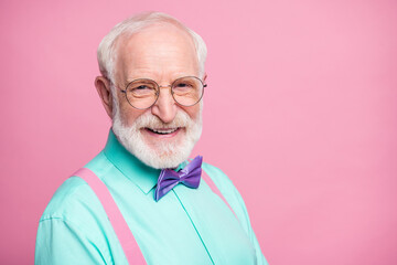 Closeup photo of amazing look grandpa positive facial expression toothy beaming smile wear specs mint shirt suspenders violet bow tie isolated pastel pink color background