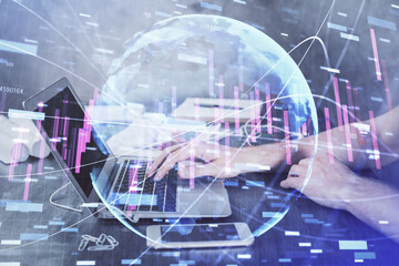 Double exposure of forex chart with man working on computer on background. Concept of market analysis.