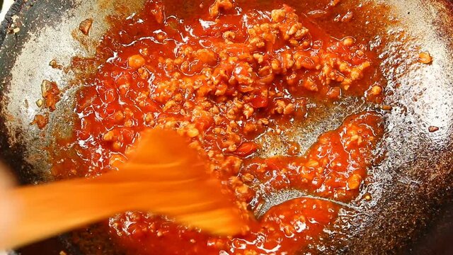 Cooking tomatoes sauce in pan, in door  Chiangmai  Thailand