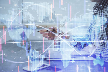 Multi exposure of businessman working on laptop on background. International business hologram in front. Concept of success.