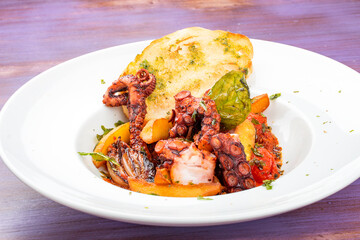 Italian-style fried octopus with tomatoes and potatoes