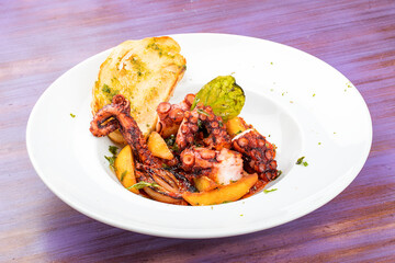 Italian-style fried octopus with tomatoes and potatoes