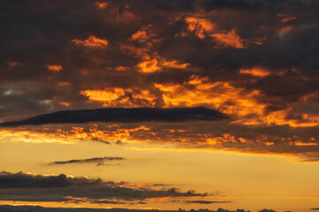 Fototapeta na wymiar beautiful, dark clouds at sunset, sunrise, orange - yellow