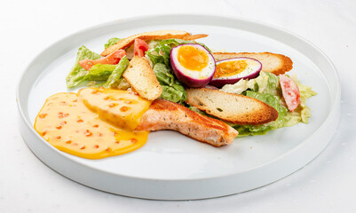 Turkey fillet with vegetables, egg and red caviar sauce