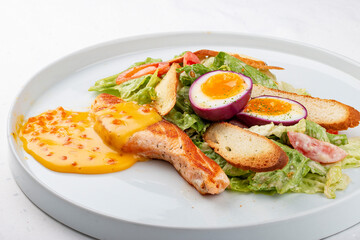 Turkey fillet with vegetables, egg and red caviar sauce
