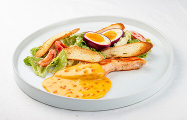Turkey fillet with vegetables, egg and red caviar sauce