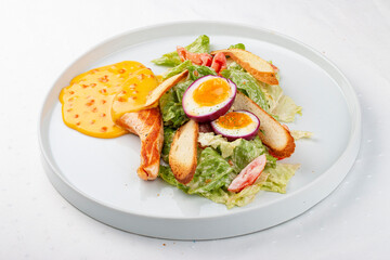 Turkey fillet with vegetables, egg and red caviar sauce