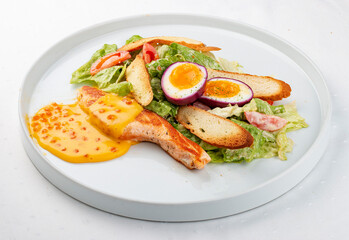 Turkey fillet with vegetables, egg and red caviar sauce