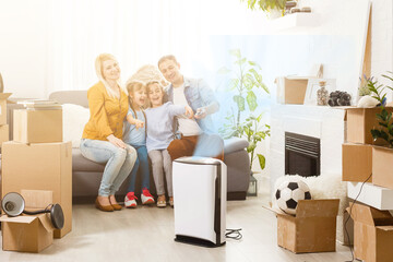 family with an air purifier moving to a new apartment