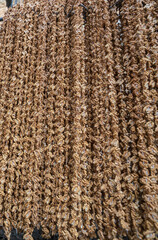 walnuts background. Walnut Sausage made by dipping a string with walnuts into a grape molasses mixture, the sweet sucuk is then hung out to dry and cut into pieces and enjoyed as a gummy-like dessert.