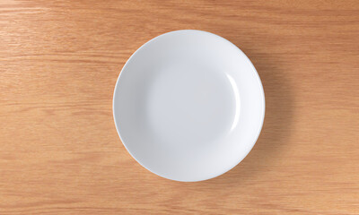 A blank white ceramic plate on a wooden table, top view, 3D rendering