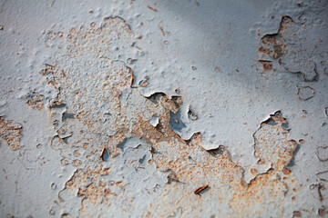 Metal surface with gray peeling paint