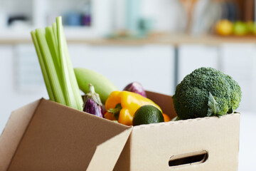 Close-up of fresh vegetables in the cardboard box