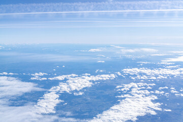 Flight over the clouds with blue sky and sunshine