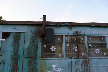 old contractor or construction trailer and road sign