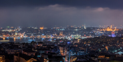 Fototapeta na wymiar Galata Tower and Suleymaniye Mosque at night in Istanbul, Turkey.
