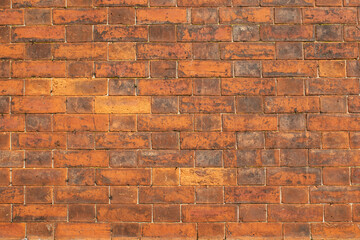 Flemish bond Victorian brickwork with natural stretcher and dark header. Background repeating pattern with copy space.