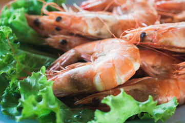 Salt baked prawn serve with lettuce on a dish