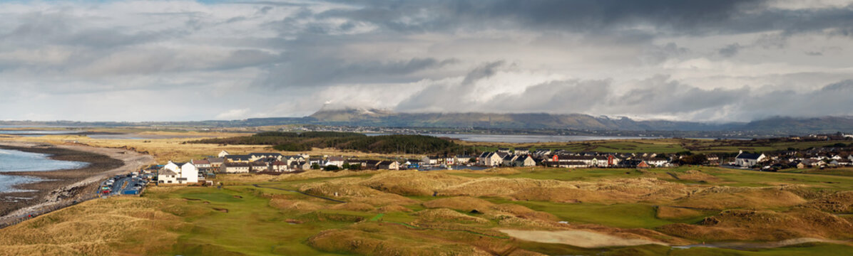 View on Strandhill town and beach in county Sligo, Ireland. Panorama image. Cloudy sky, Benbulben in the background.