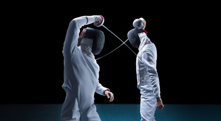 Two fencers are fighting in a tournament. The concept of fencing.