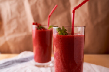 Strawberry and banana smoothies with long glass glasses on tablecloths