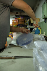 Adhesive tape packing of metal products and hands