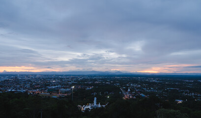 Fototapeta premium Evening city Hat Yai from Khao Kho Hong view Hat Yai, Songkhla. The twilight sky in sunset city top view