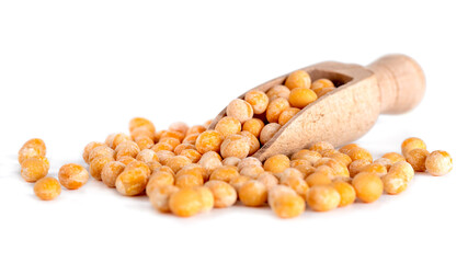 Dried yellow peas in the wooden spoon, isolated on white