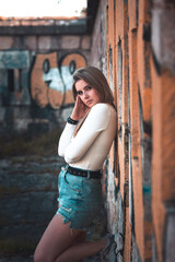 Naklejka premium Young girl posing in old ruins.