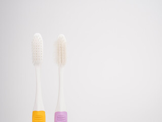 Comparison Concepts. Old used and new pastel toothbrush comparison on white background .