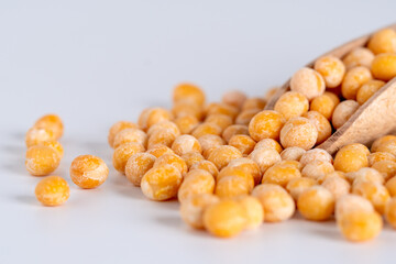 Heap of whole dry yellow peas isolated on white background