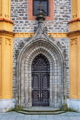 Fototapeta na wymiar Old massive church door of the catholic church