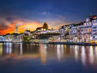 Fototapeta na wymiar Long exposure of limmat river side swiss city at night in Zurich Switzerland