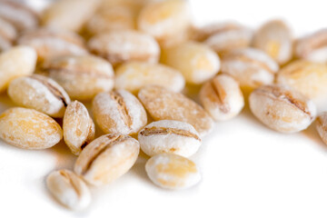 Heap of pearl barley isolated on white, food