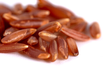 Heap of red rice isolated on white background, food